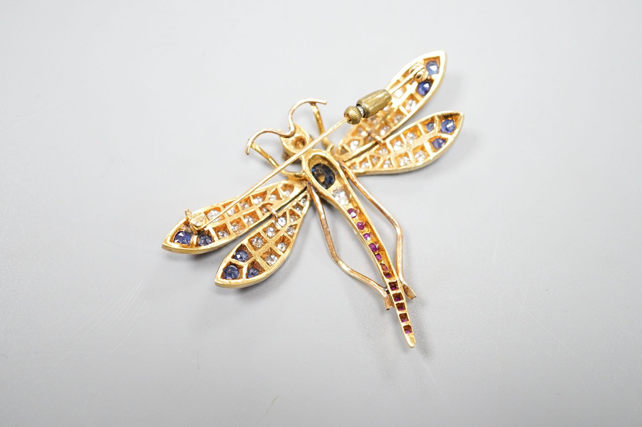 A Victorian style 14k, ruby, sapphire and diamond set dragonfly brooch, 47mm, gross weight 18.5 grams.